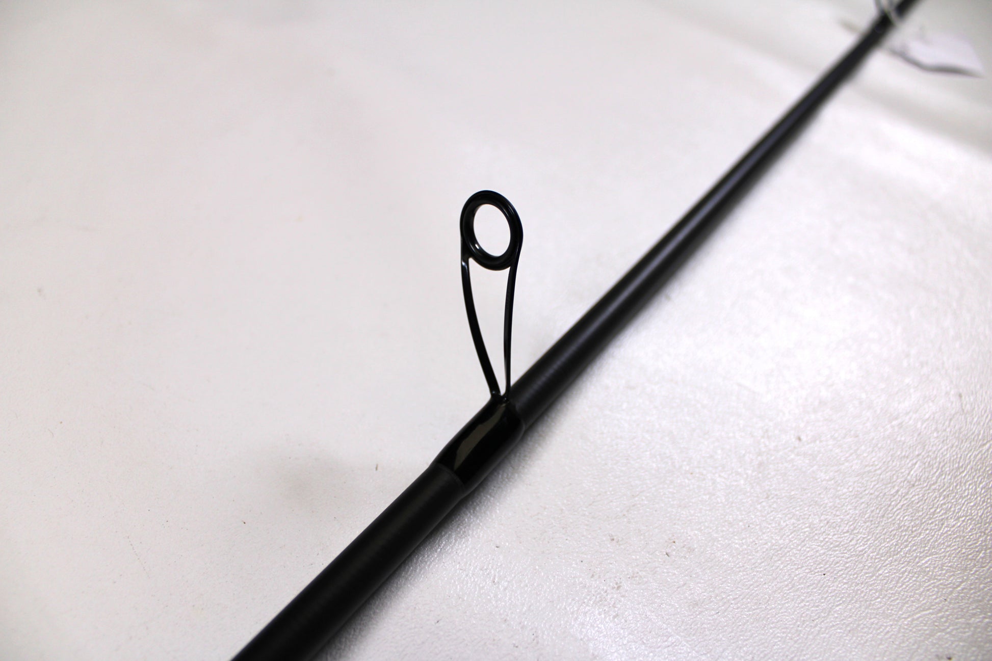 A close-up of the Kistler Helium MIC-HESHTB70MHS 7'0" Medium Heavy Used Spinning Rod—Excellent Condition—ideal for trading in your used fishing gear through our Rod and Reel Trade-In Program for store credit.