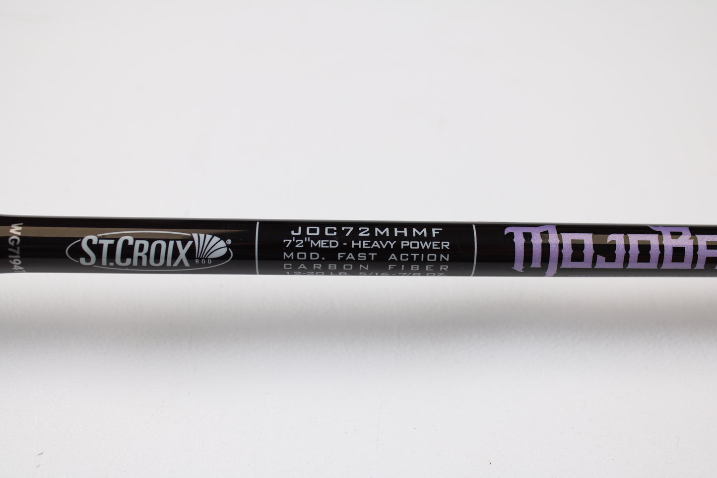 Close-up of a used St. Croix Mojo Bass JOC72MHMF Finesse Carbon Cranker 7'2" Medium Heavy casting rod in excellent condition—ideal for the Rod and Reel Trade-In Program. "ST. CROIX" and "MOJO" logos visible on carbon fiber finish.