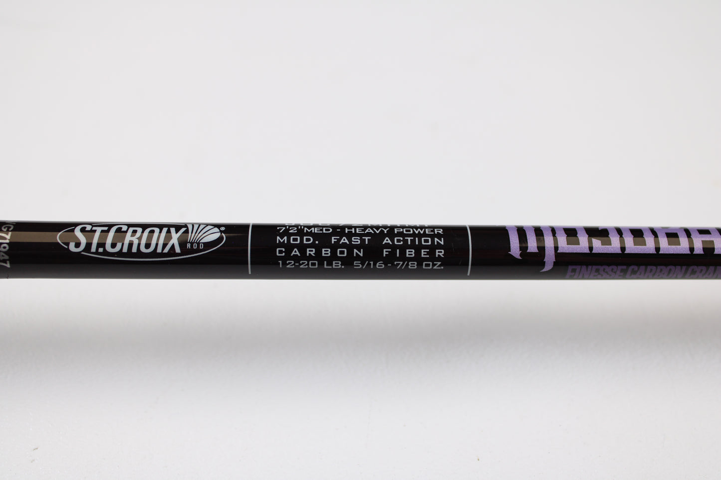 A close-up of the St. Croix Mojo Bass JOC72MHMF Finesse Carbon Cranker 7'2" Medium Heavy Casting Rod—Used, Excellent Condition—ideal for upgrading your setup and earning store credit with our Rod and Reel Trade-In Program.