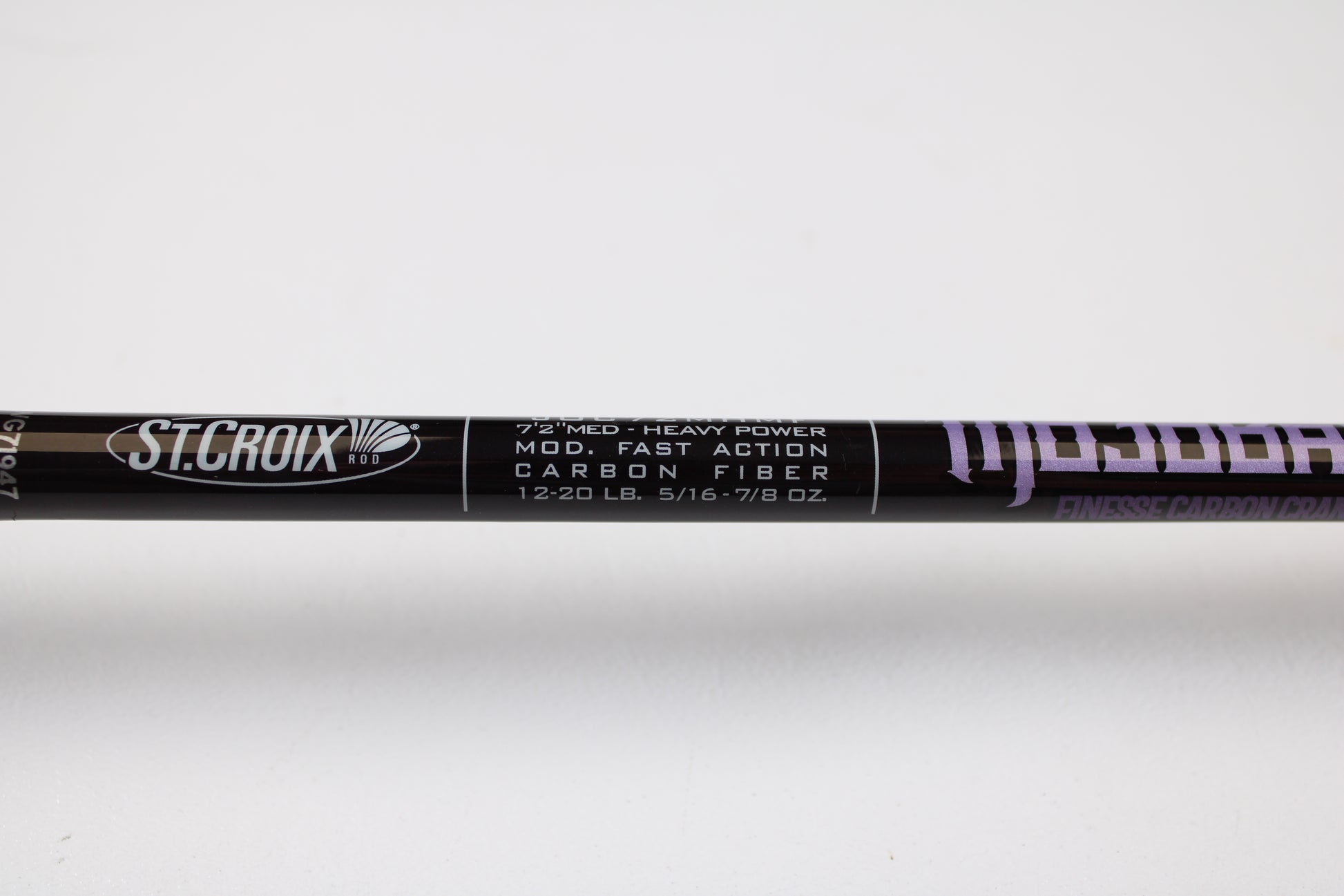 A close-up of the St. Croix Mojo Bass JOC72MHMF Finesse Carbon Cranker 7'2" Medium Heavy Casting Rod—Used, Excellent Condition—ideal for upgrading your setup and earning store credit with our Rod and Reel Trade-In Program.