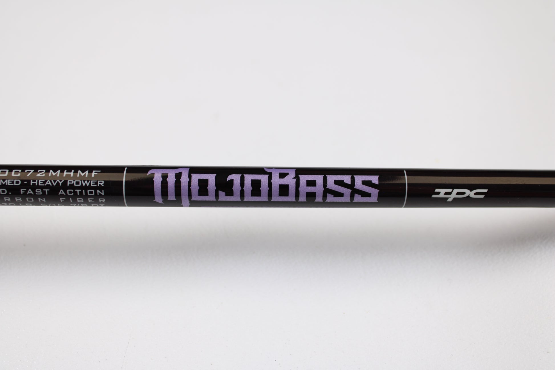 A close-up of a St. Croix Mojo Bass JOC72MHMF Finesse Carbon Cranker 7'2" Medium Heavy casting rod in excellent used condition—ideal for those interested in our Rod and Reel Trade-In Program or upgrading their gear.