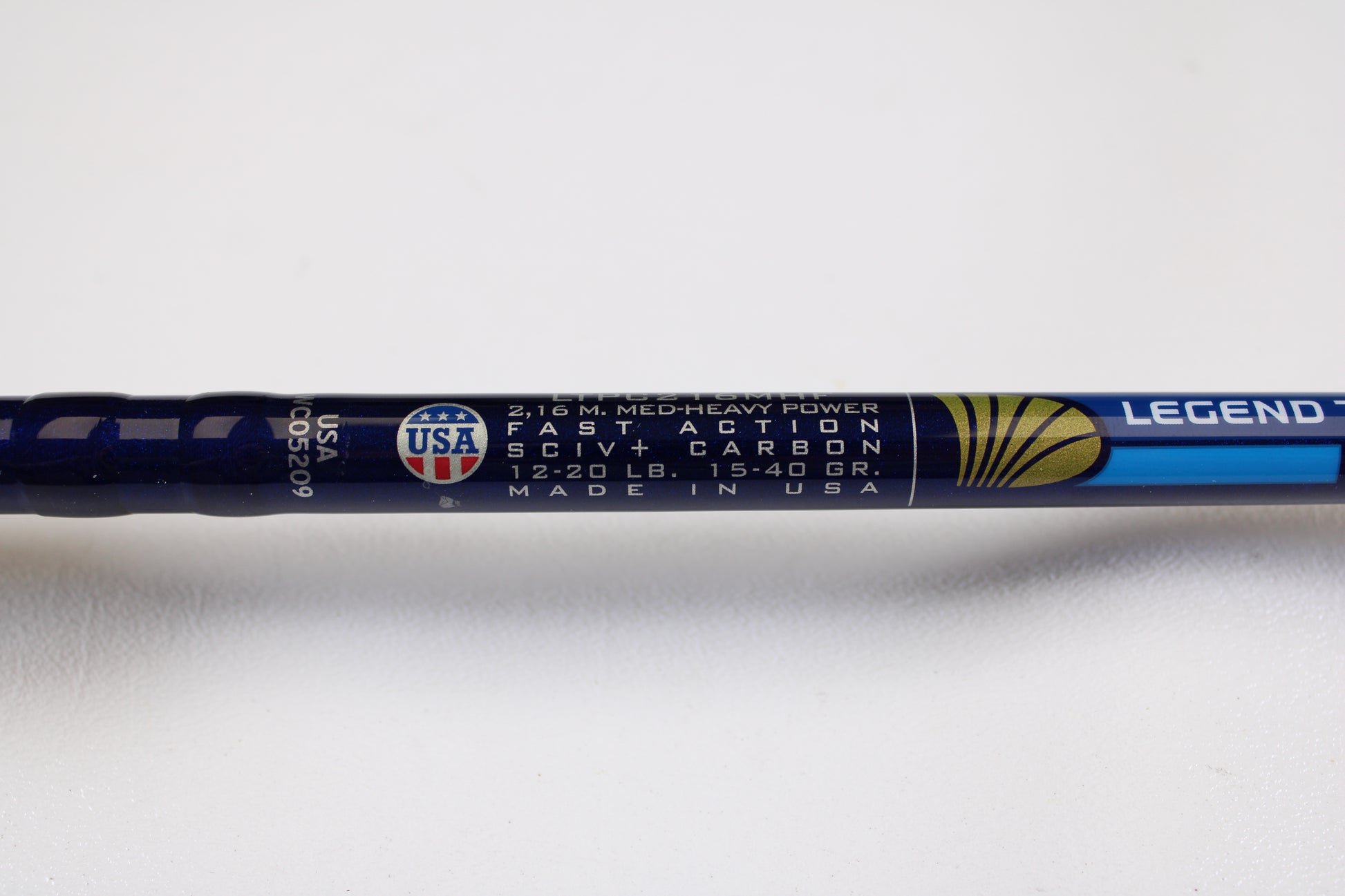 Close-up of a St. Croix Legend Tournament Pike Versatile Special LTPC216MHF 7'1" Med-Heavy casting rod, used in excellent condition—upgrade today with our rod and reel trade-in for store credit! USA flag emblem included.