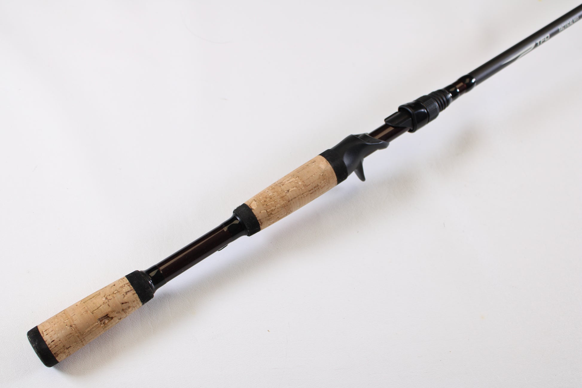 The Temple Fork Tactical Bass TAC SB 726-1 7'2" Heavy Used Casting Rod—excellent condition—shown on a white background, is ideal for upgrading through our Rod and Reel Trade-In Program or earning store credit with used gear.