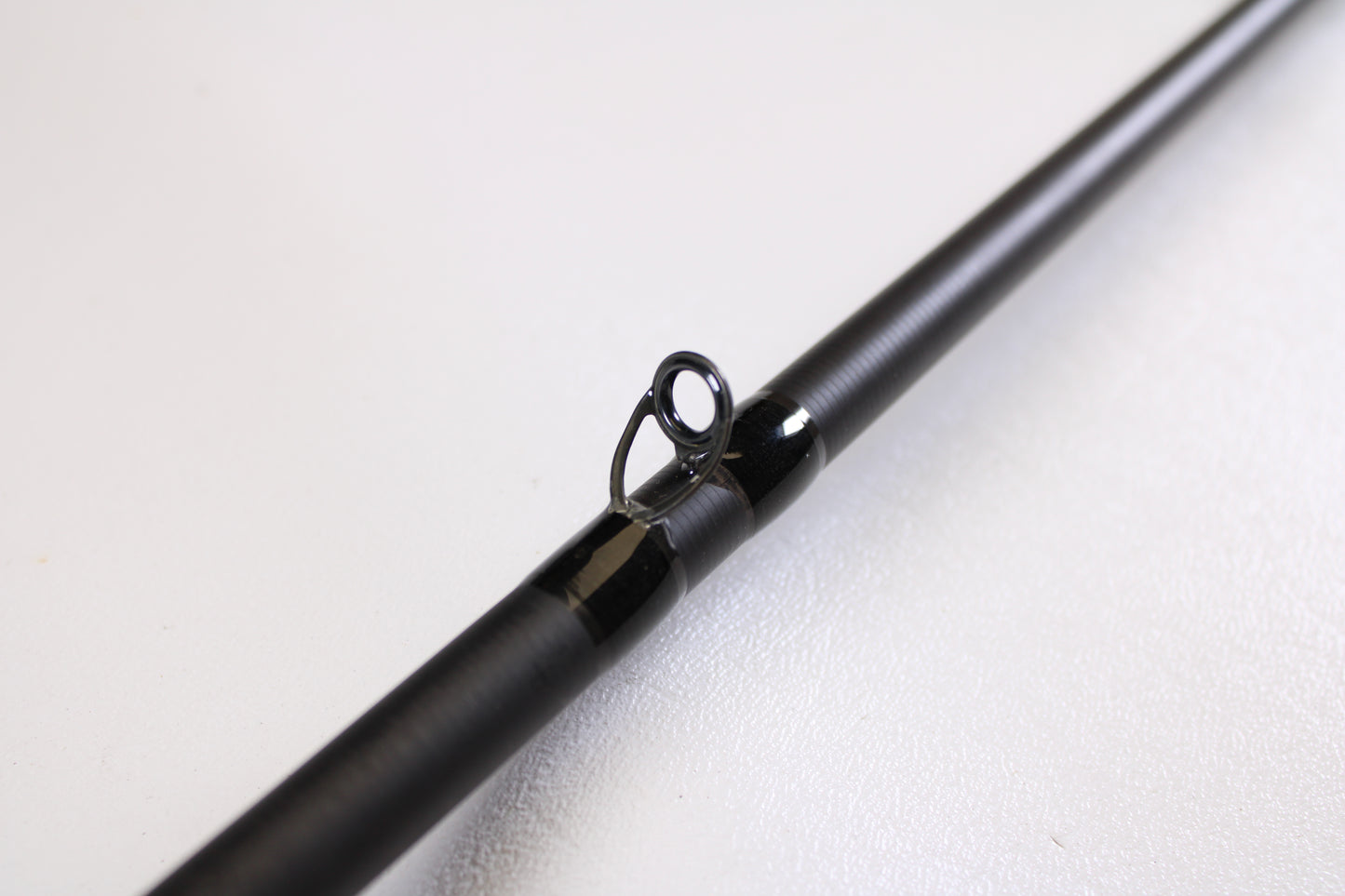 Close-up of the 13 Fishing Muse 7'6" Medium Heavy Used Casting Rod in excellent condition, highlighting a line guide—ideal for anyone considering used gear or our rod and reel trade-in program for store credit.