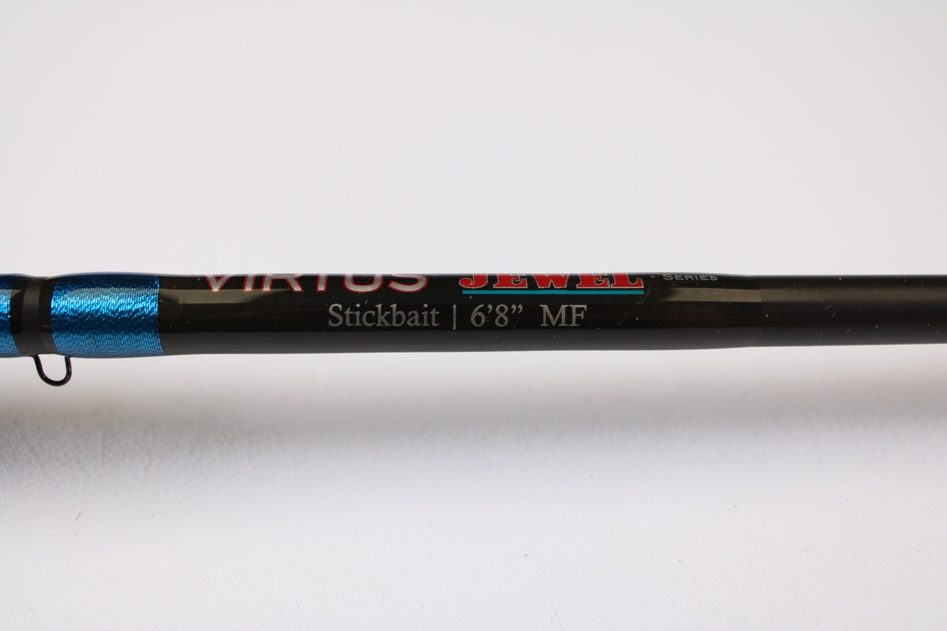 Close-up of a Jewel Virtus Stickbait 6'8" Medium Used Casting Rod in excellent condition, black and blue shaft, shown on white—ideal for anglers upgrading with our Rod and Reel Trade-In Program for store credit.