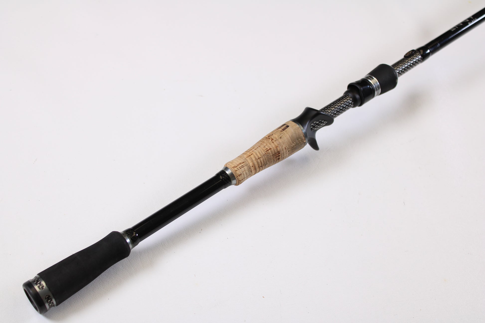 A close-up of the 13 Fishing Envy Black EBC711H 7'11" Heavy Used Casting Rod in very good condition—ideal for those looking to upgrade gear through our rod and reel trade-in program for store credit.