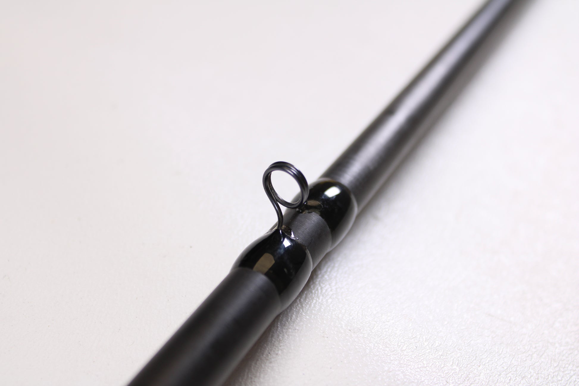 Close-up of a 13 Fishing Envy Black EBC711H 7'11" Heavy Casting Rod in very good used condition—an ideal choice for anyone considering an upgrade or taking advantage of our rod and reel trade-in program.