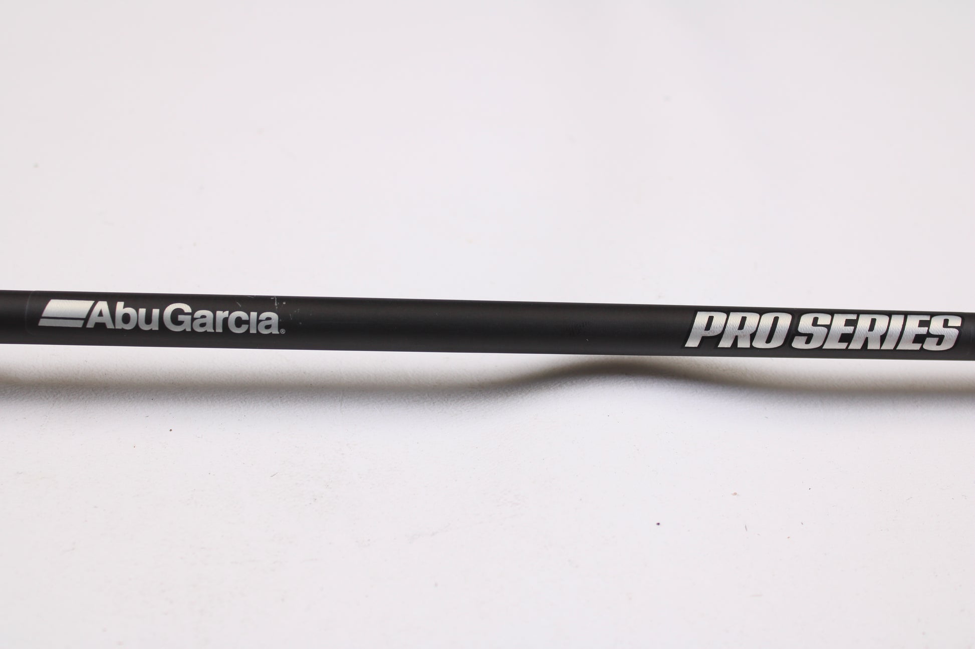 A close-up of the Abu Garcia Pro Series PSJCC76-6 John Cox Shallow Crankbait 7'6" Medium Heavy Used Casting Rod in excellent condition, ideal for upgrading via our Trade-In Program or shopping quality used gear, set on a plain white background.