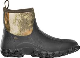 The Lacrosse Alpha Mudlite Moc Next G1 Camo 7in Slip On Mocs (Size 13) features a waterproof, lightweight ankle-high design with a rugged black sole, black lower section, and camouflage-patterned upper for excellent outdoor traction.