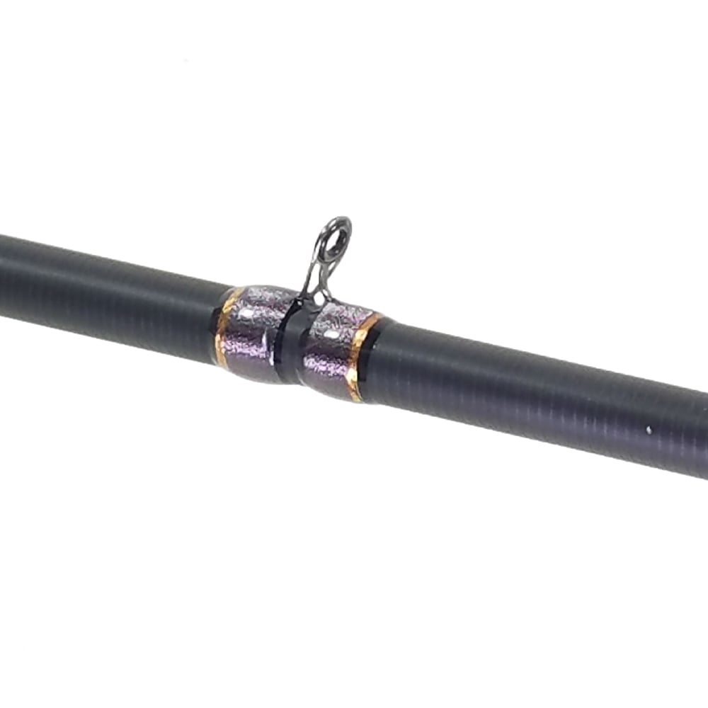 Close-up of the ALX ENOX Casting Rod Hunch 7'0" Medium made with Toray Carbon Fiber, featuring a metallic guide ring with shiny silver and gold accents, set against a plain white background.