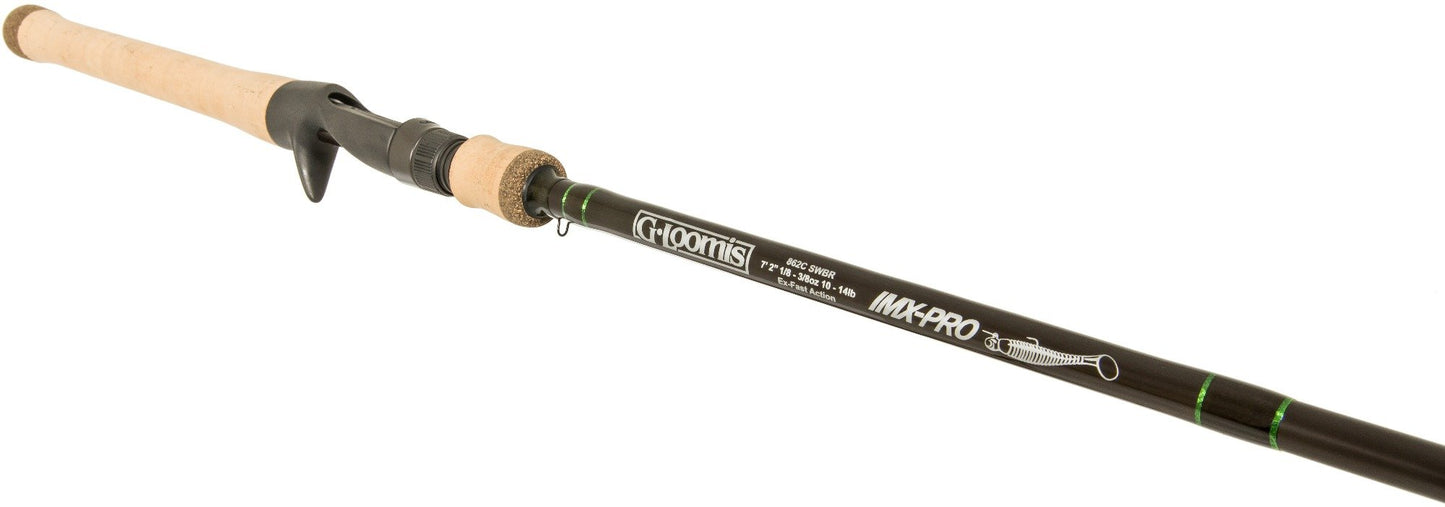 A close-up of the G. Loomis IMX-PRO Swimbait 862C SWBR 7'2" Medium Casting Rod (12895-01) shows a cork handle, black reel seat, and black blank with white and green G. Loomis branding and details.