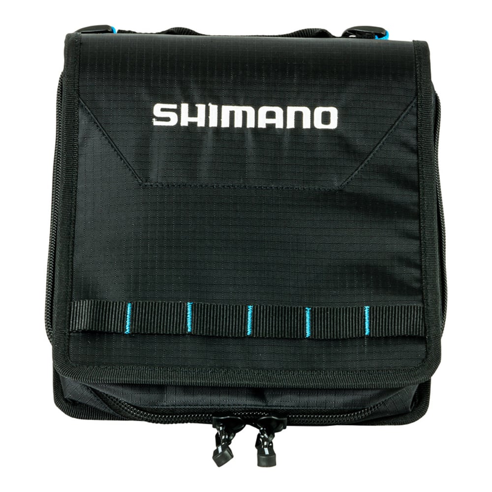 The Shimano Baraja Worm Binders by Shimano is a black carrying case with blue stitching, webbing loops, a zippered bottom pouch, and flap with white Shimano logo—ideal for storing soft plastics or organizing fishing tackle.