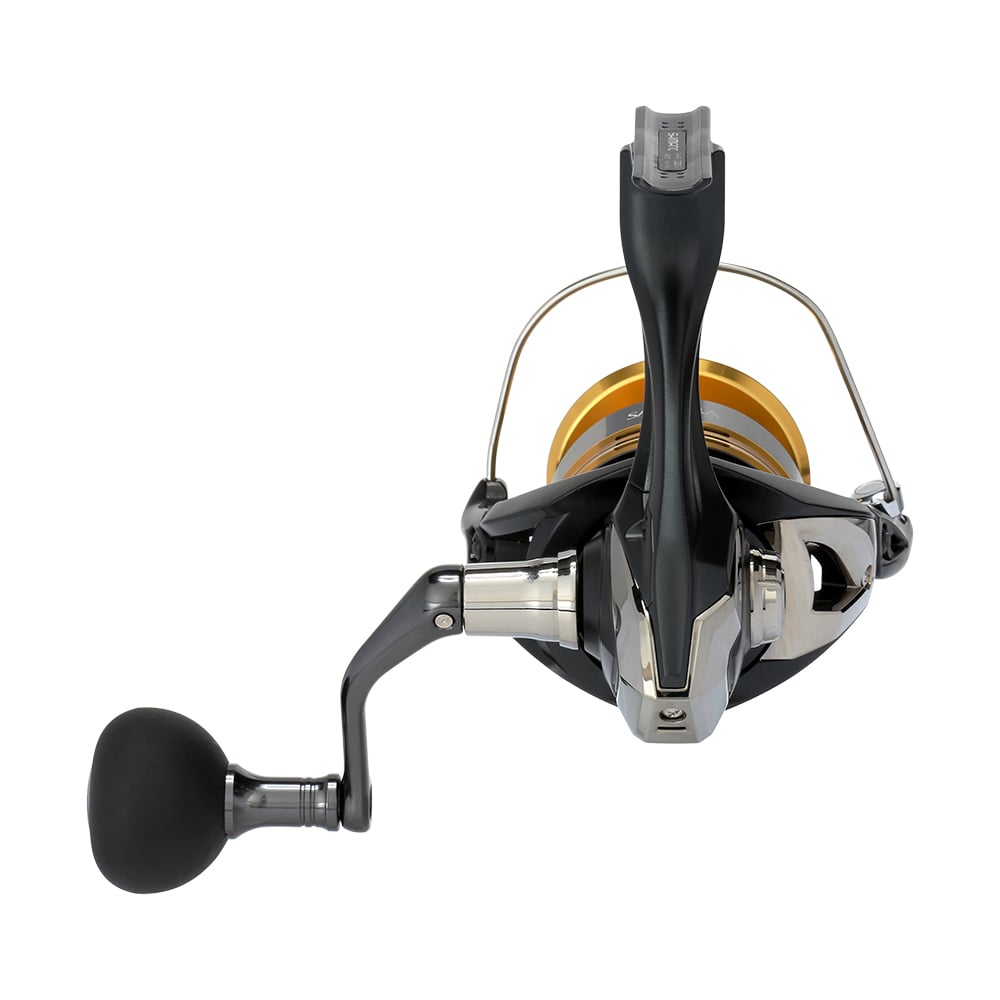 The Shimano Sahara FJ Spinning Reel 5000XGFJ in black and silver features a gold spool, left-side handle with a black grip, and advanced HAGANE Gear for smooth operation, elegantly displayed against a white background.