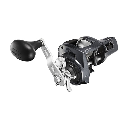 The Shimano Tekota 400HGLCA 6.6:1 Line Counter Casting Reel (TEK400HGLCA) features a silver and black design, large ergonomic handle, sturdy frame, and visible gears for precision and durability, making it a reliable Shimano baitcasting reel.