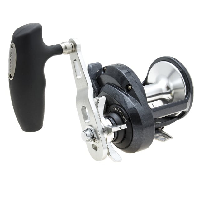 A close-up of the Shimano Torium 30PGA Star Drag Fishing Reel (TOR30PGA) by Shimano, featuring a large ergonomic handle, metal frame and spool, set against a white background.