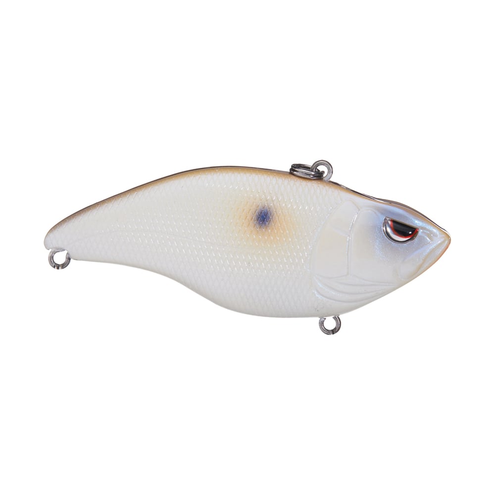 The Spro Aruku Shad Lipless Crankbait by SPRO is a realistic fish-shaped lure featuring a white body, brown top, blue spot, red eye, two attachment loops, and Gamakatsu treble hooks. Its textured surface mimics fish scales for authenticity.