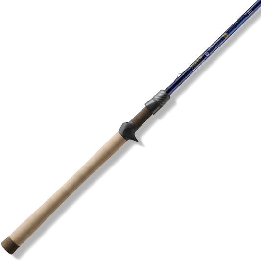 The St. Croix Legend Tournament Bass Casting Rod 7'10" Extra Heavy Mag Cranker (LBTC710XHM) features a long cork handle, dark reel seat, and deep blue shaft—ideal for anglers needing serious cranking power. Displayed on a white background.