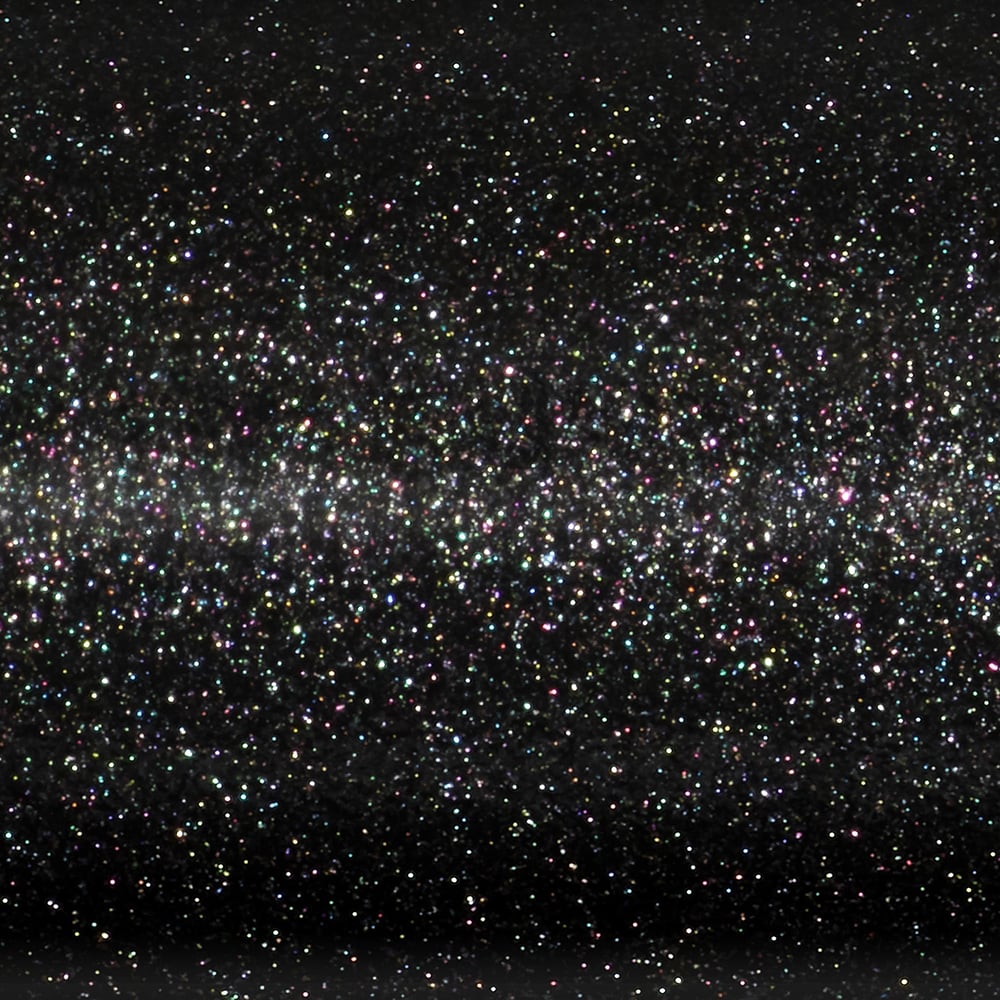 A surface covered in fine black glitter, sparkling with multicolored reflections—much like the starry-night finish on a St. Croix Legend Xtreme 6’10” Medium Light Spinning Rod (XFS610MLXF) by St. Croix.