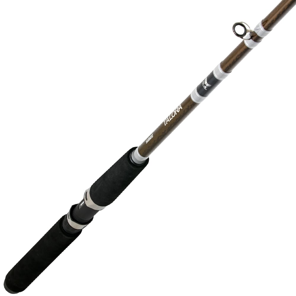 A close-up of the Shimano Talora 10'6" Medium Dipsy Diver Rod (TLA106M2A) by Shimano, featuring a black foam handle, brown shaft, metal guides, and white accents, displayed diagonally on a white background.