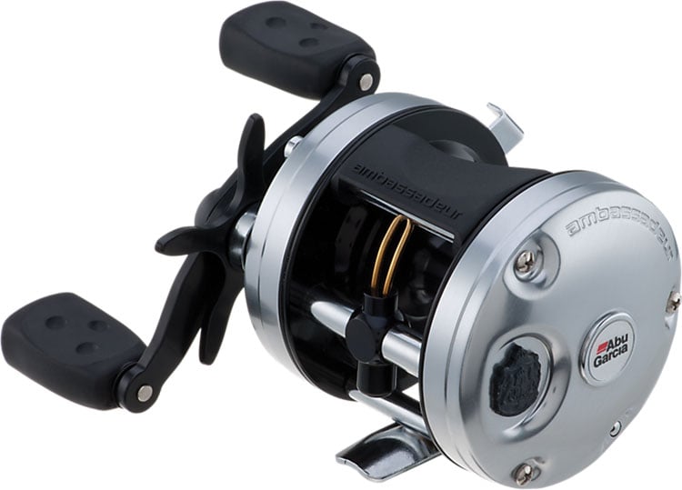 The Abu Garcia Ambassadeur C3 5.3:1 Casting Reel 5500, in silver and black with a crank handle and thumb bar, is displayed at an angle on a white background, showcasing its Carbon Matrix drag system.