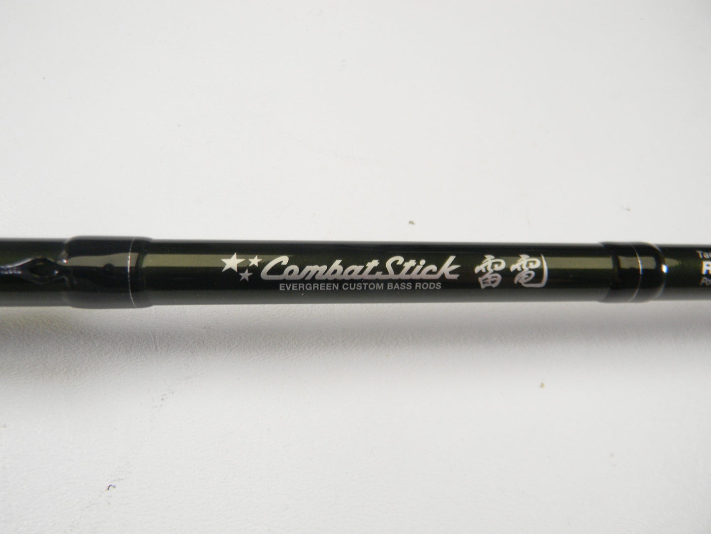 A close-up of the Evergreen Combat Stick RCTC-68HG Tactical Moving Versatile 6'8" Heavy Glass used casting rod in excellent condition, ideal for anglers interested in our Rod and Reel Trade-In Program or quality pre-owned gear.