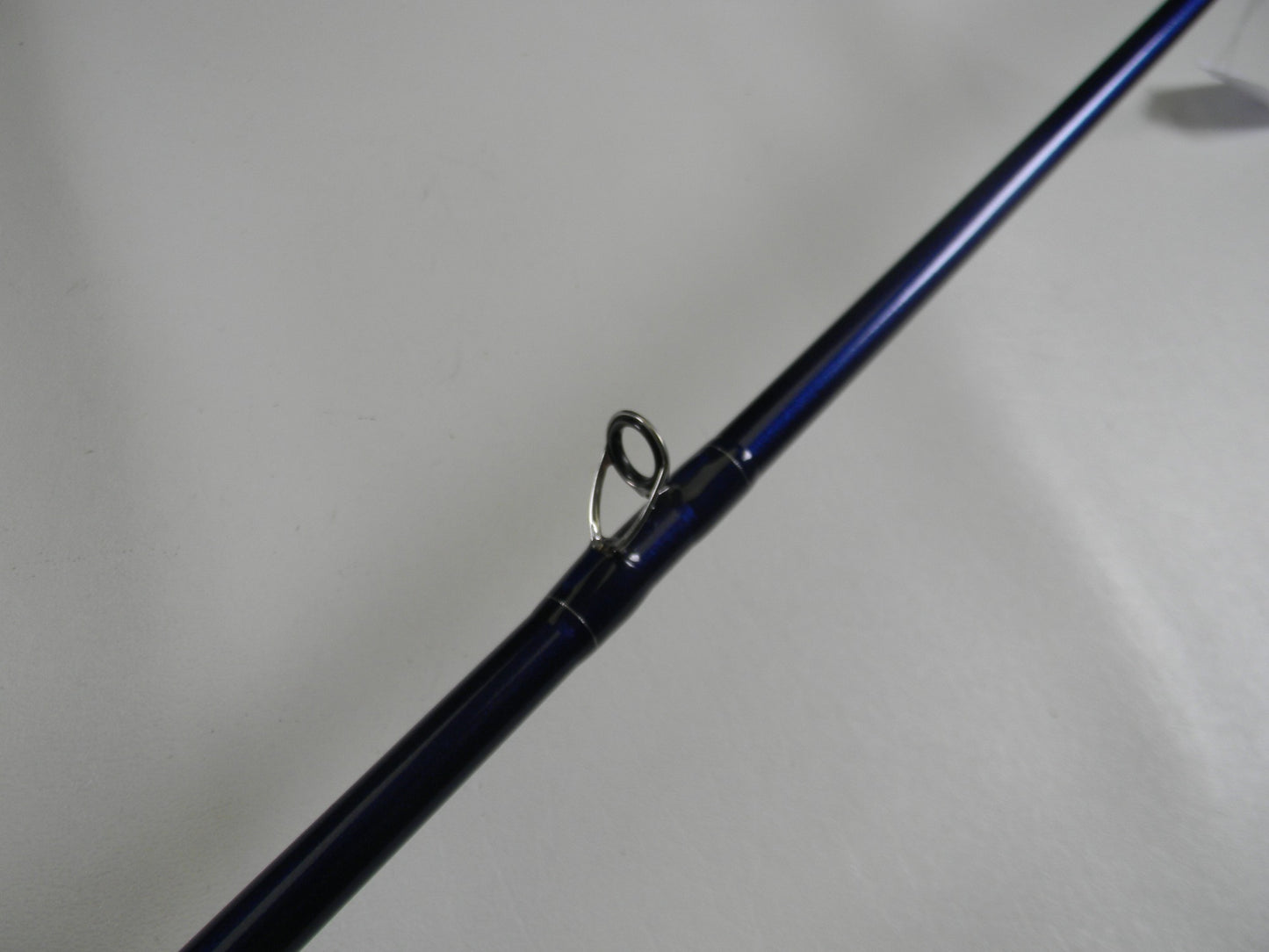 A close-up of a St. Croix Legend Tournament Bass TBC710HM Magnum Cranker 7'10" Heavy casting rod in excellent used condition, showing the metal guide ring—ideal for those trading in their gear for store credit.