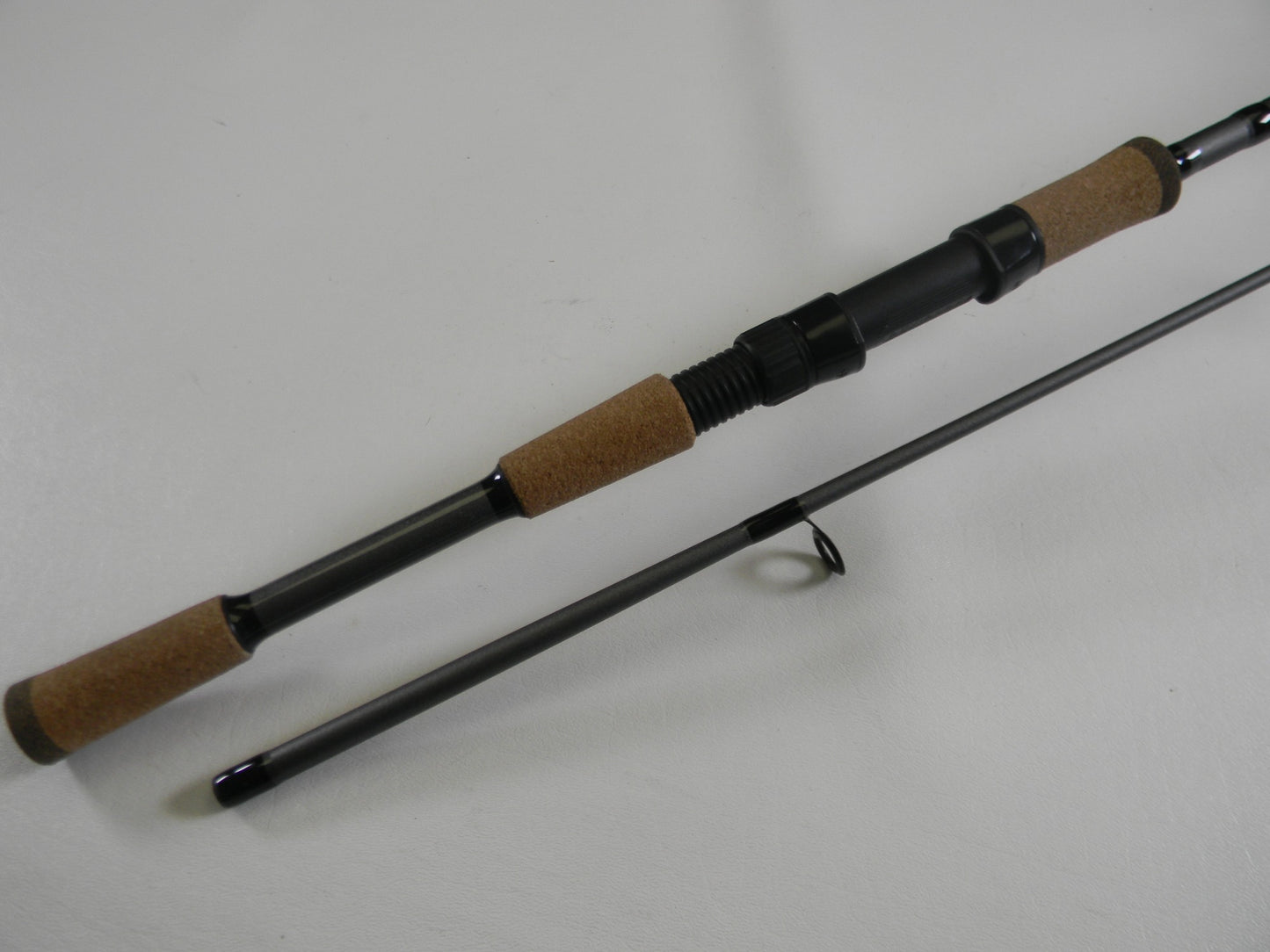 Upgrade with our Rod and Reel Trade-In Program: Get store credit for your used gear, like this St. Croix X Trek CTCS70MF2-C 7'0" Medium Used Spinning Rod in excellent condition, featuring cork handles and a black reel seat.