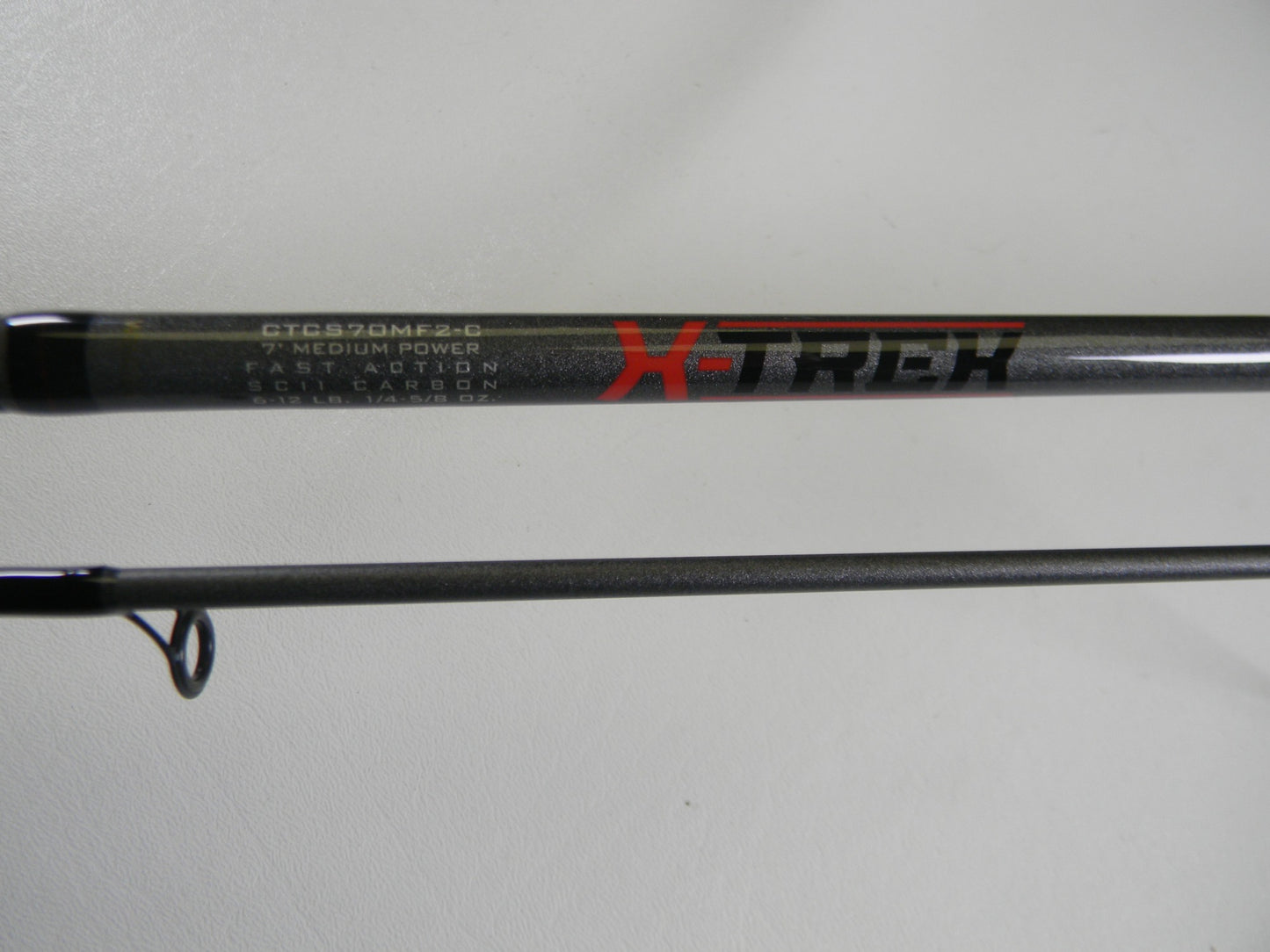 Close-up of a St. Croix X Trek CTCS70MF2-C 7'0" Medium Used Spinning Rod in excellent condition—ideal for our Rod and Reel Trade-In Program if you're upgrading your used gear.