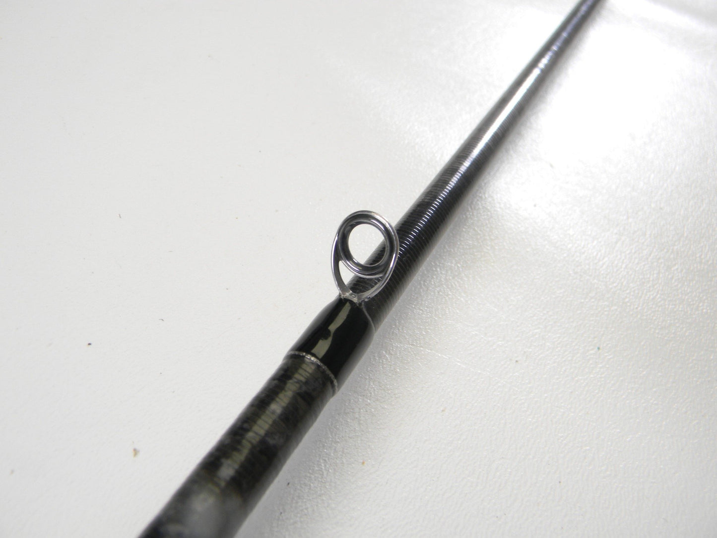 Close-up of the Evergreen Combat Stick Heracles HFAC-70HST 7'0" Heavy Used Casting Rod in excellent condition—ideal for anyone looking to upgrade with our Rod and Reel Trade-In Program for store credit.