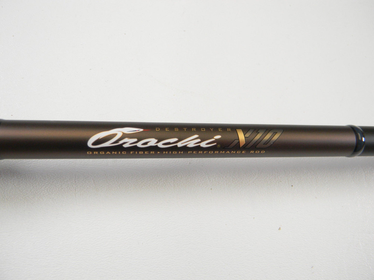Close-up of a Megabass Orochi X10 F7-71XT Swamp Survivor 7'1" Heavy Used Casting Rod in excellent condition—ideal for anglers seeking quality pre-owned gear or considering a rod and reel trade-in.