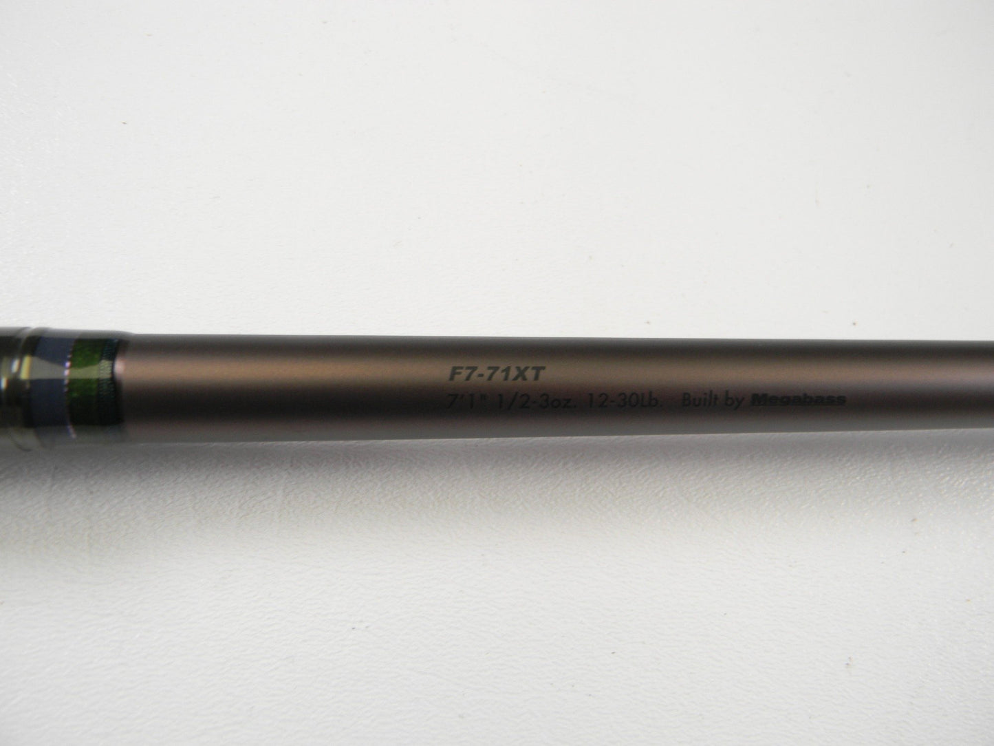 A close-up of a used Megabass Orochi X10 F7-71XT Swamp Survivor 7'1" Heavy Casting Rod in excellent condition—perfect for those seeking quality used gear or trade-in opportunities through our rod and reel program.