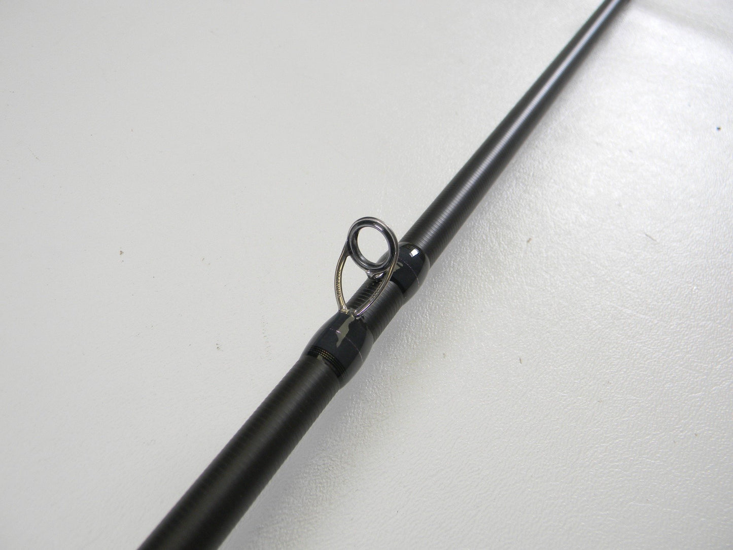 A close-up of a Megabass Destroyer P5 F7-75X BMG 7'5" Heavy Used Casting Rod in excellent condition—ideal for our Rod and Reel Trade-In Program if you want to upgrade or earn store credit with your used Megabass gear.