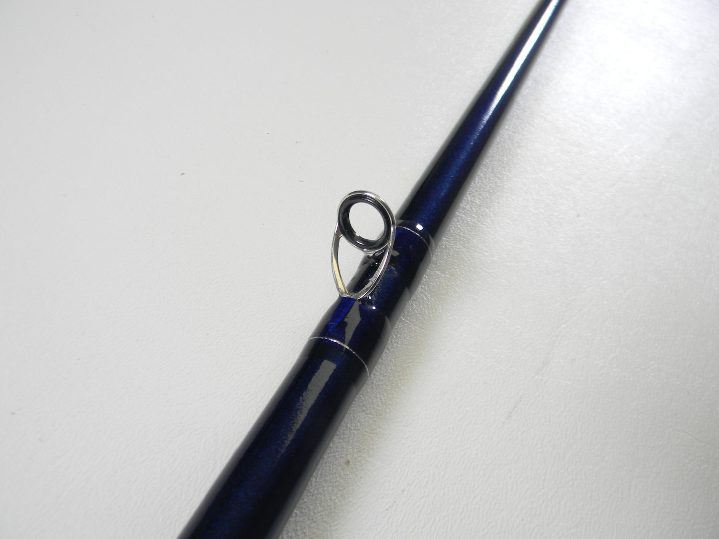 Close-up of a St. Croix Legend Tournament Bass TBC710HF Swimbait 7'10" Heavy Used Casting Rod in excellent condition, highlighting the metal guide ring—ideal for those considering our Nation's Best Rod and Reel Trade-In Program.