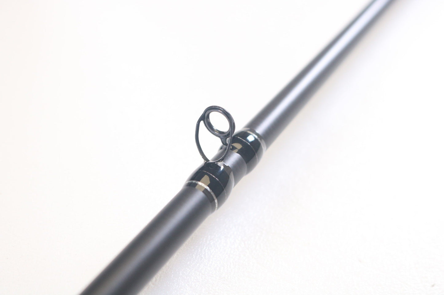 Close-up of the 13 Fishing Muse Black MBC71M 7'1" Medium Used Casting Rod in excellent condition, highlighting a line guide—ideal for anglers shopping used gear or using our Rod and Reel Trade-In for store credit.