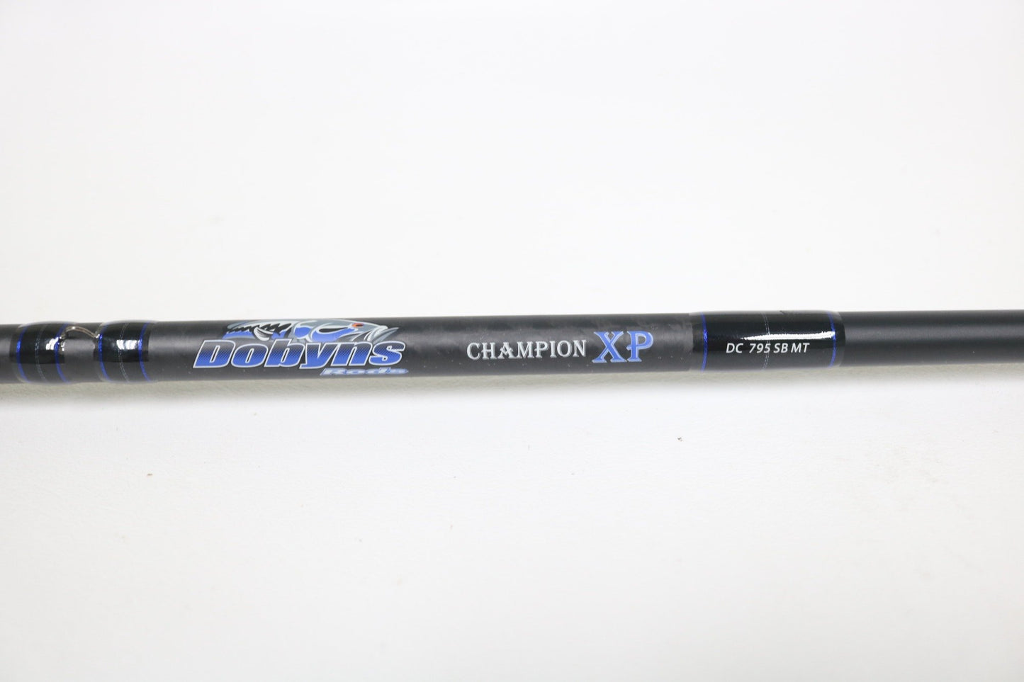 Close-up of a Dobyns Champion XP DC 795SB MT 7'9" Medium Heavy Used Casting Rod in excellent condition, displaying the brand logo and model—ideal for trade-ins or those shopping for quality used Dobyns fishing gear.