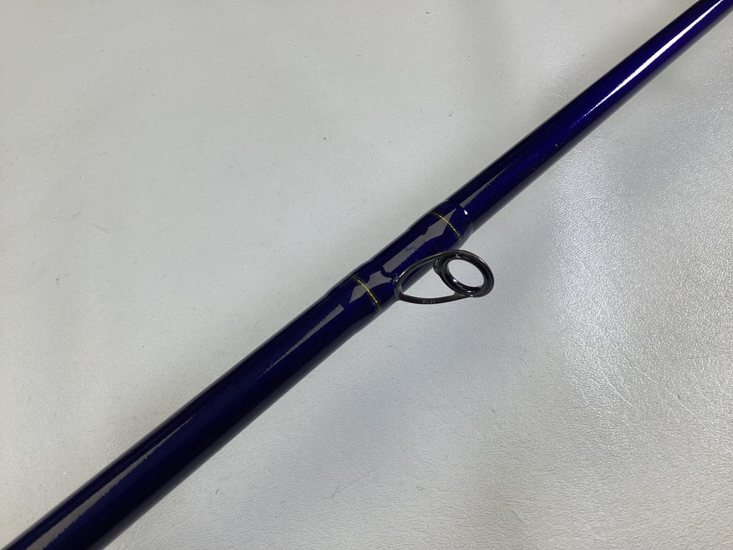 A close-up of a St. Croix Legend Tournament Musky Casting Rod Split Cork 8'3" Heavy Lipstick II in mint condition—ideal for anglers upgrading through our Rod and Reel Trade-In Program or earning store credit for used gear.