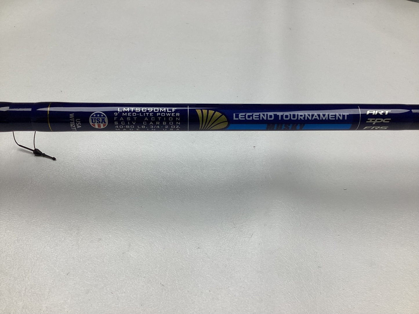 A close-up of a St. Croix Legend Tournament Musky Casting Rod Split Cork 9'0" Medium Light Bantam Bait, in mint used condition, with medium-light power and fast action visible on a light surface.