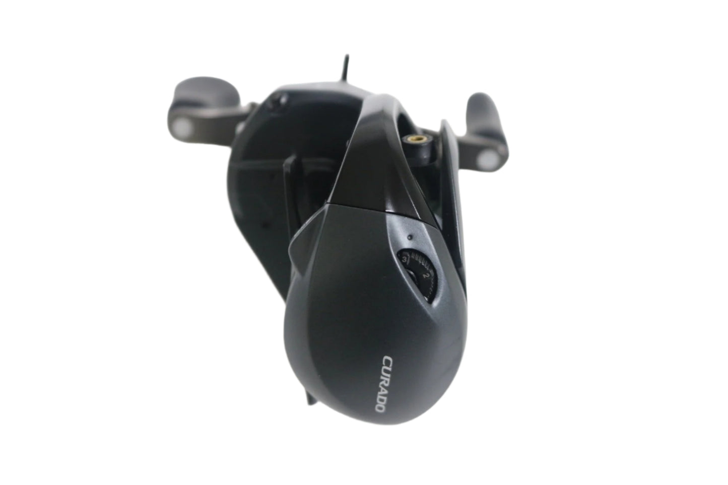 A Shimano Curado BFS CUBFSXGR 8.2:1 RH used casting reel in excellent condition rests on a white surface, showcasing its sleek design and visible adjustment knobs. If you're considering an upgrade, explore our rod and reel trade-in program for great deals on used gear.