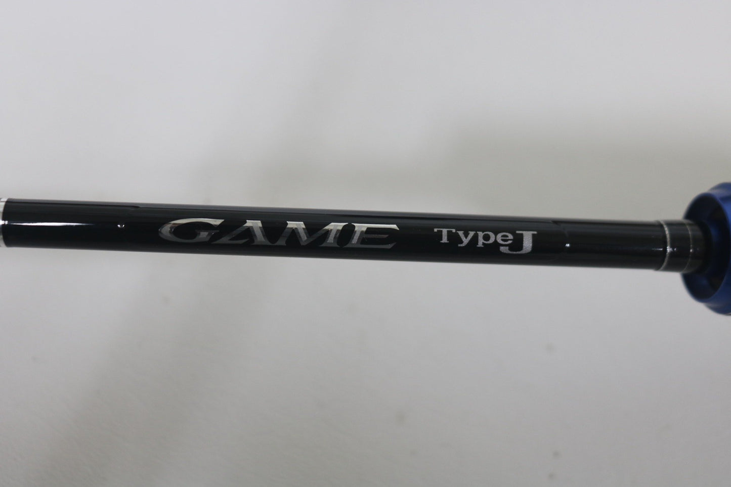 Close-up of the Shimano Game Type J 6'0" Used Casting Rod in excellent condition, showing "GAME type J" in silver—ideal for our Rod and Reel Trade-In Program where you can earn store credit for quality used Shimano gear.