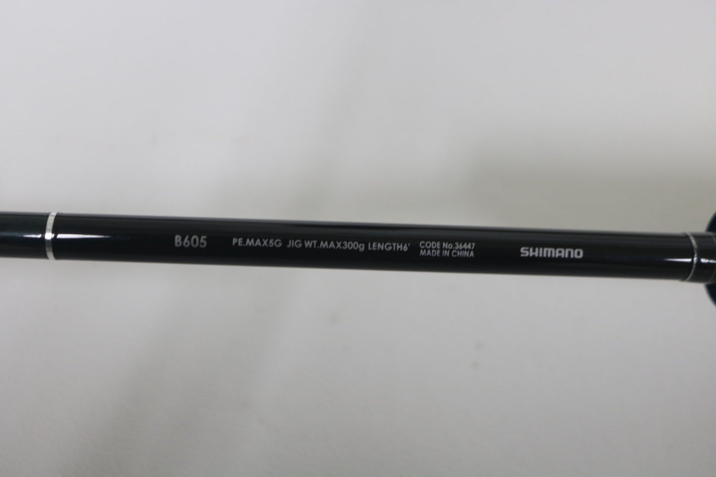 A close-up of the Shimano Game Type J 6'0" Used Casting Rod in excellent condition shows its specs, making it a top choice for those looking to trade in used gear for store credit through our Rod and Reel Trade-In Program.