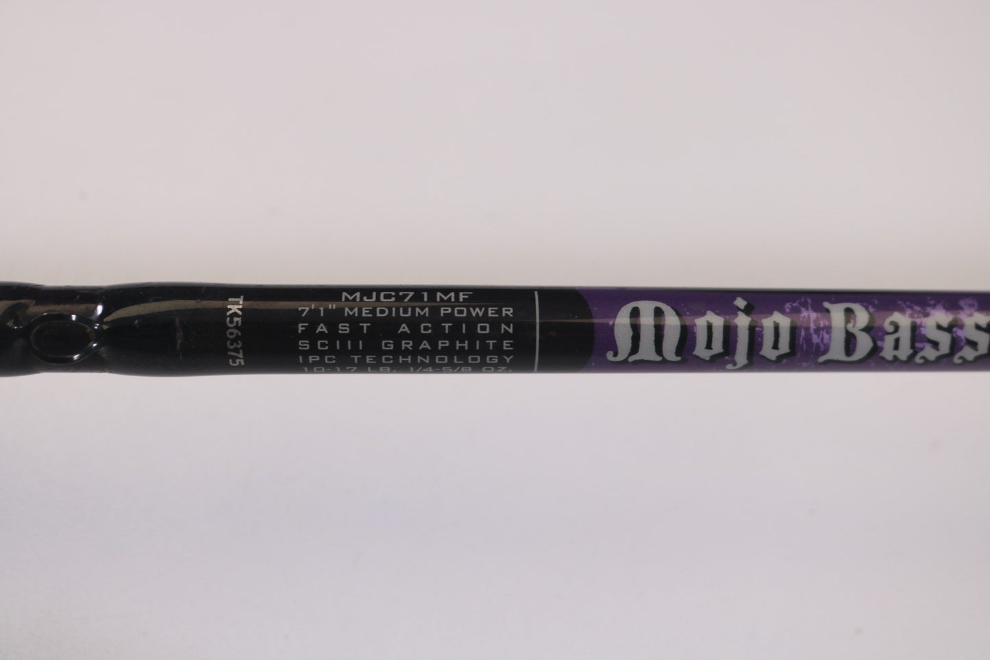 Close-up of a St. Croix Mojo Bass MJC71MF Plastics used casting rod in very good condition, labeled "Mojo Bass," with specs: 7'1" Medium Power, Fast Action, SCIII Graphite, IPC Technology. Ideal for those seeking used gear or using our Rod and Reel Trade-In Program for store credit.