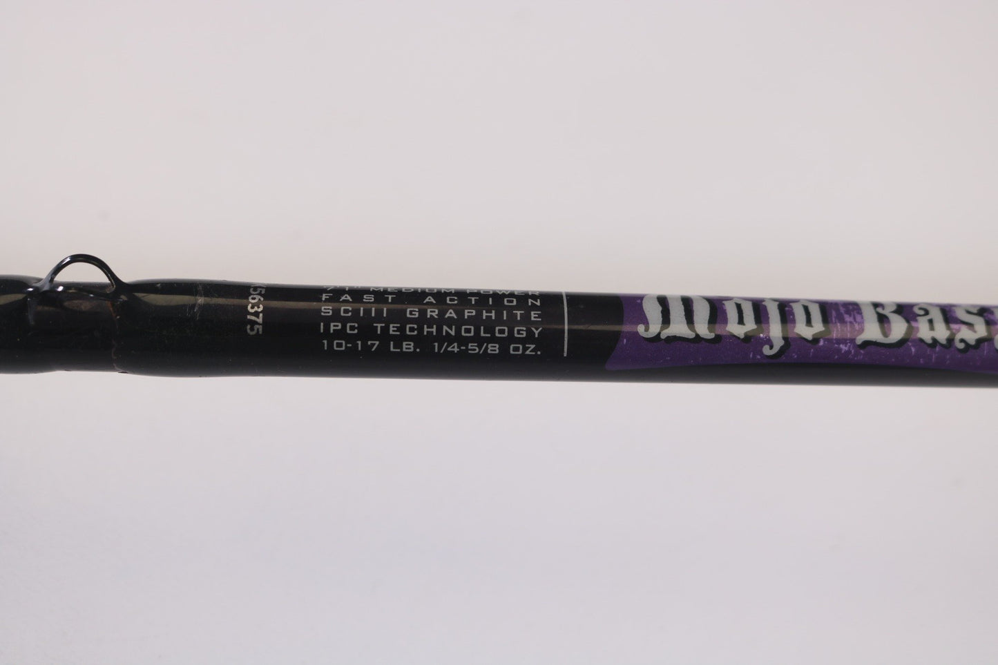 Close-up of a St. Croix Mojo Bass MJC71MF Plastics 7'1" rod in black and purple, displaying "Fast Action," "SCIII Graphite," "IPC Technology," and "10-17 lb. 1/4-5/8 oz." Perfect for our Rod and Reel Trade-In Program to earn store credit on used gear.