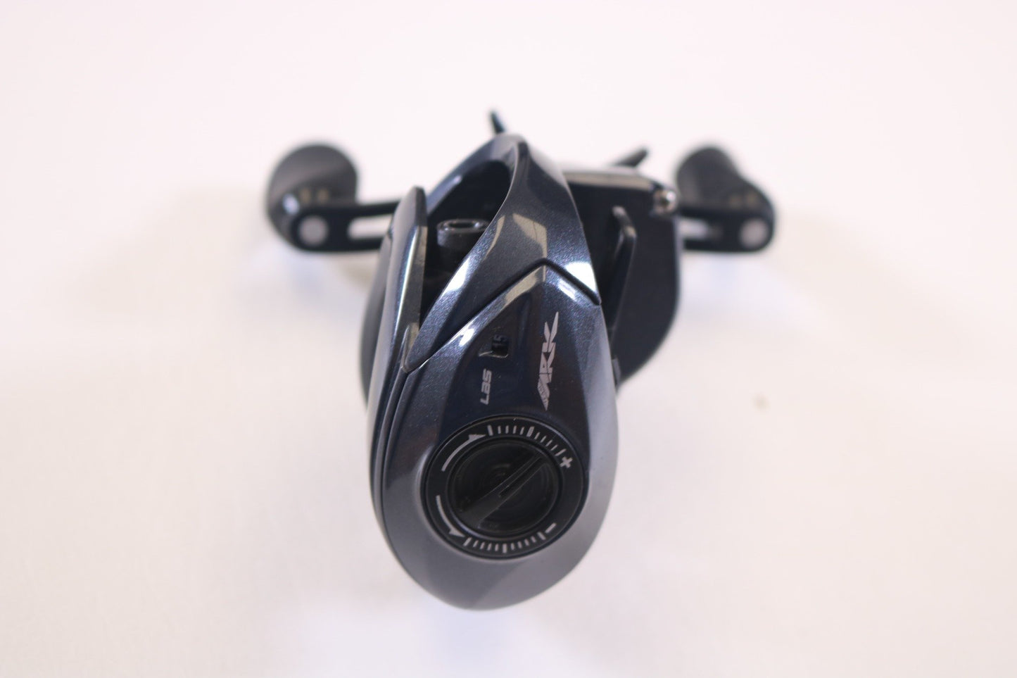 A close-up of the Ark Fishing Gravity 3 G3107L 7.1:1 LH Used Casting Reel in excellent condition, viewed from the front at an angle on a plain white background—ideal for those interested in used gear or our rod and reel trade-in program.