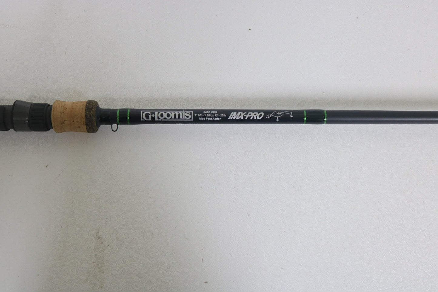 A close-up of a G. Loomis IMX-PRO 847C CBR 7'0" Heavy Used Casting Rod in excellent condition—ideal for our Rod and Reel Trade-In Program or upgrading your used gear for store credit.