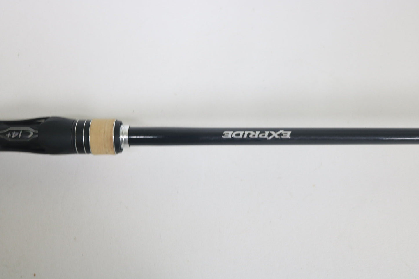 A close-up of a Shimano Expride A EX172MHGA Used Casting Rod in excellent condition, featuring "EXPRIDE" on the black shaft, photographed against a plain white background.