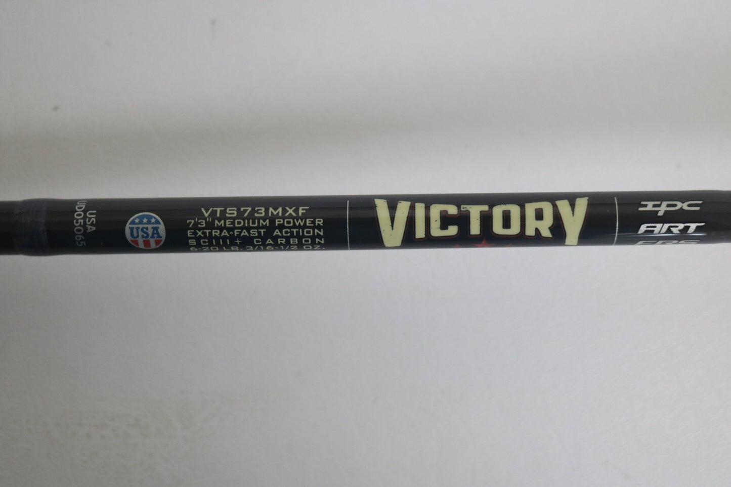 A close-up shows the St. Croix Victory VTS73MXF Used Spinning Rod in excellent condition, featuring "VICTORY," "VTS73MXF," "7'3" medium power, extra-fast action," "SCIII+ carbon," and a small USA flag logo on the left side.