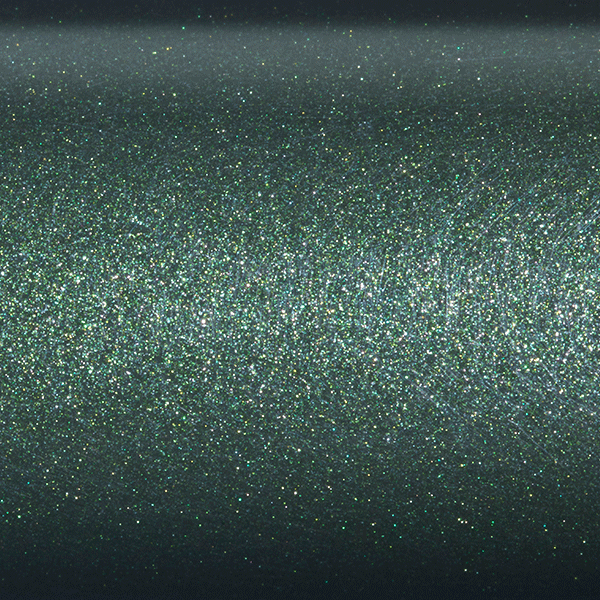 A close-up of a dark green, shimmery surface resembling the St. Croix Legend Elite 7'0" Light Spinning Rod (ES70LF) captures light beautifully, casting a rainbow-like spectrum with its holographic effect.