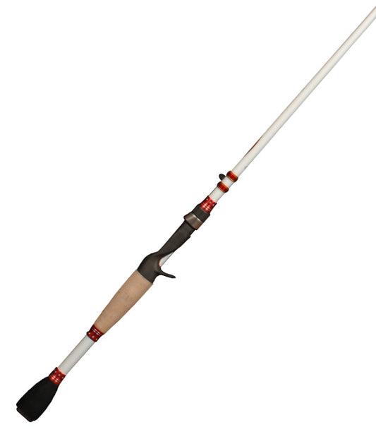 A white Duckett Micro Magic Pro 7'6" Heavy Casting Rod with a beige handle, black grip, and red accents is angled against a plain backdrop; its carbon fiber scrim provides strength, while the reel seat above allows easy access.
