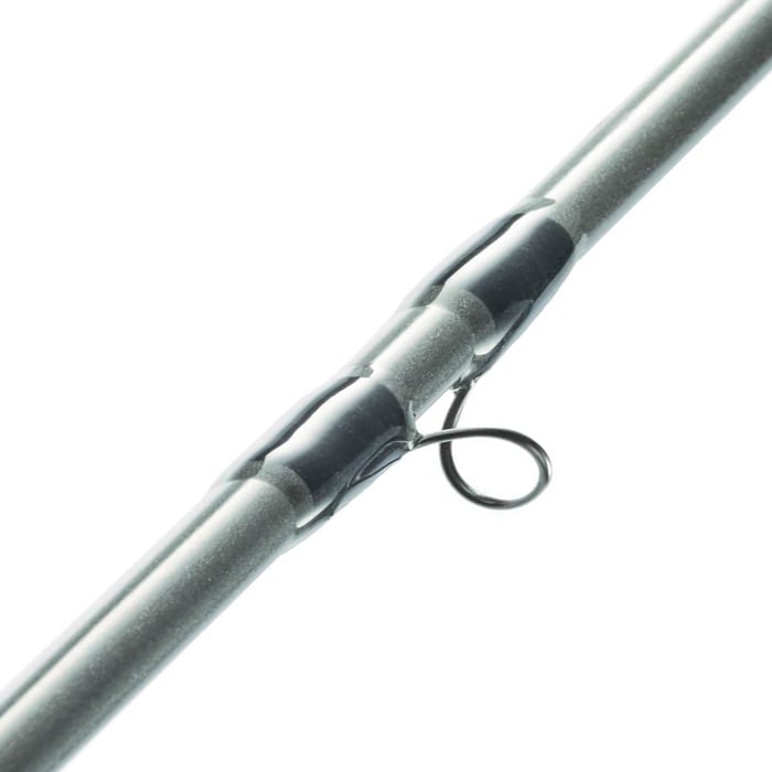 Close-up of the St. Croix High Stick Drifter 9'6" 4wt Fly Rod, highlighting a metal line guide secured with dark wrappings on the silver-gray rod.