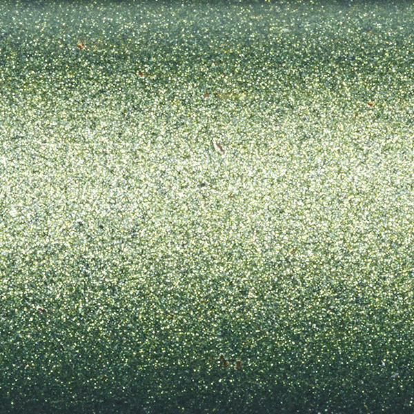 Close-up of a sparkly, metallic green surface with fine glitter-like texture, reminiscent of the shimmering finish on the St. Croix Legend Elite Panfish 7'0" Light Spinning Rod (LEP70LXF).